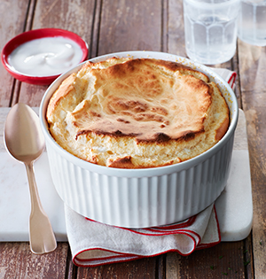Cheese Souffle made with Astro Yogurt in sitting on top of a wooden table.